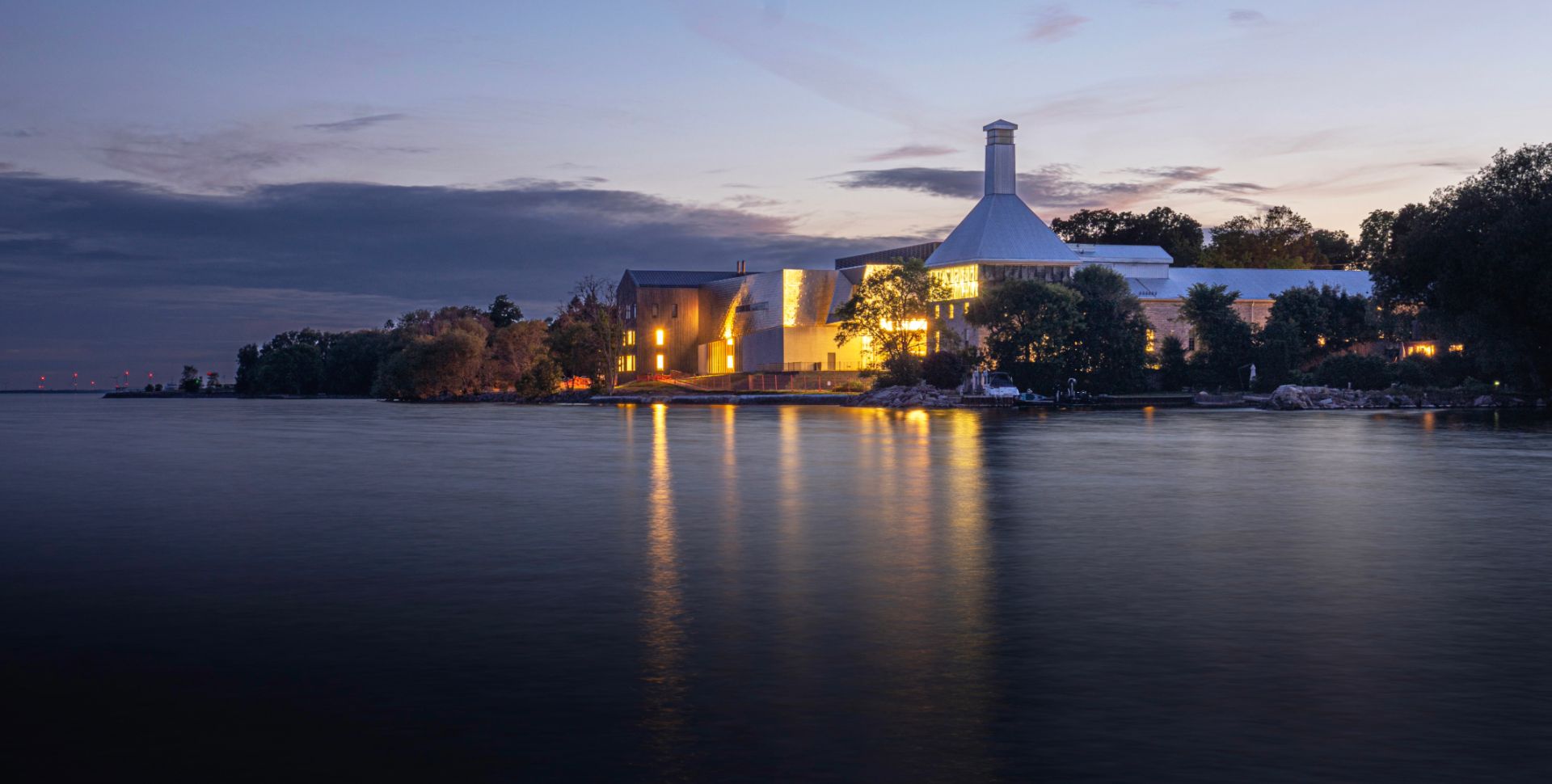 View of the Tett Centre in the evening with all its lights on.