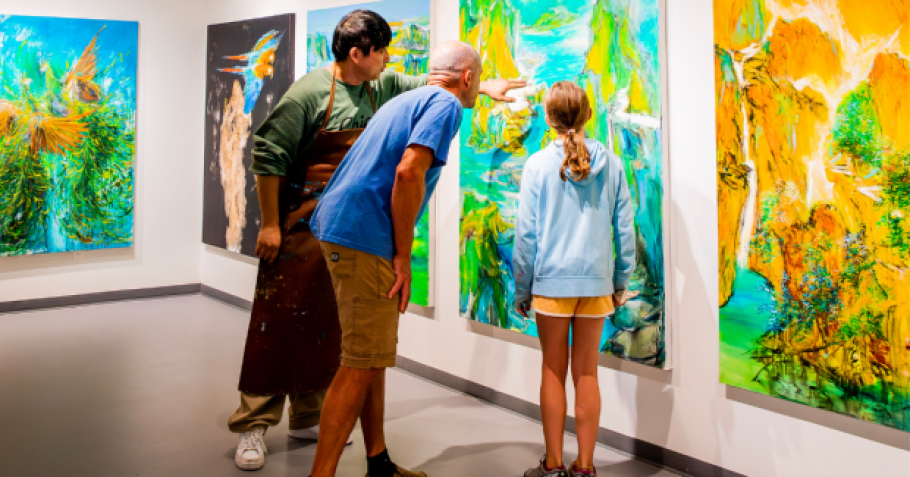 Pengyuan Wang shows his work to visitors in the Tett Gallery