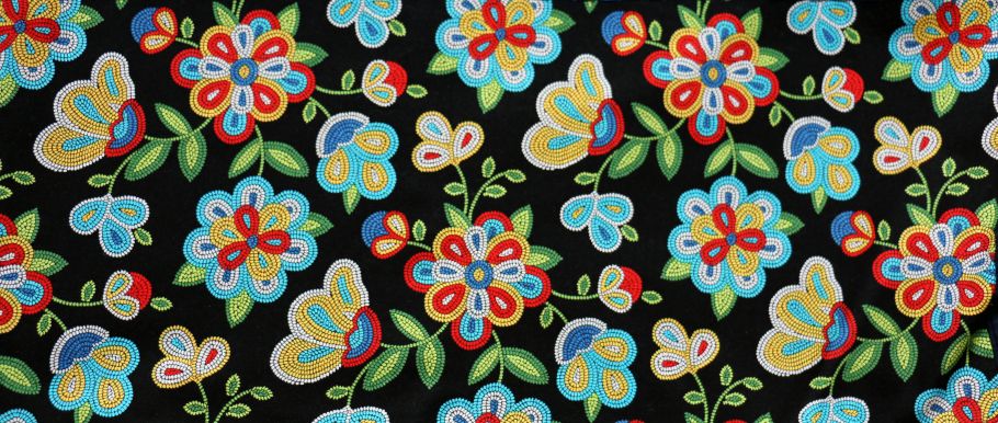 Beaded flowers across a black backdrop