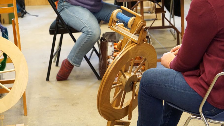 A person spinning on a wheel in KHWS studio.