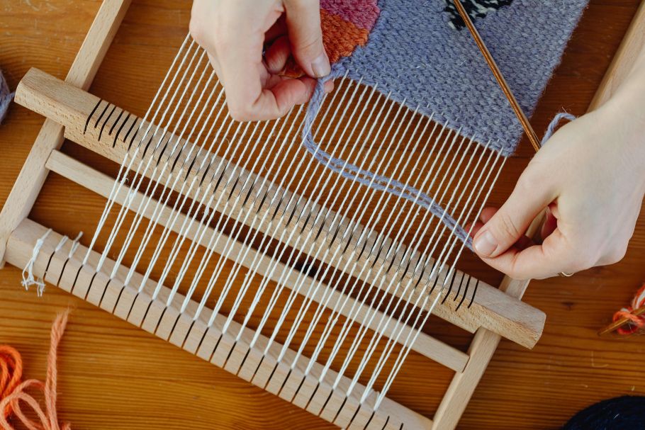 Weaver working on a loom.