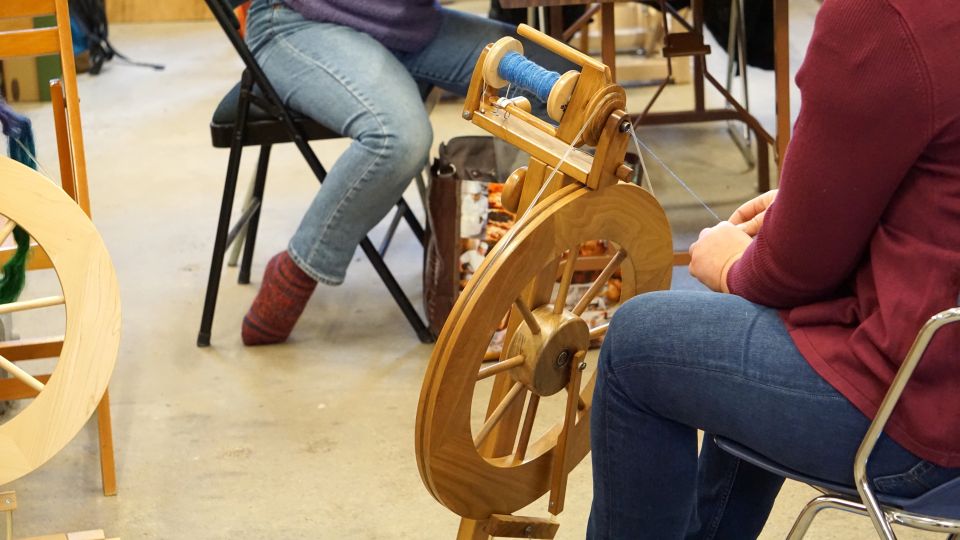 A person spinning on a wheel in KHWS studio.