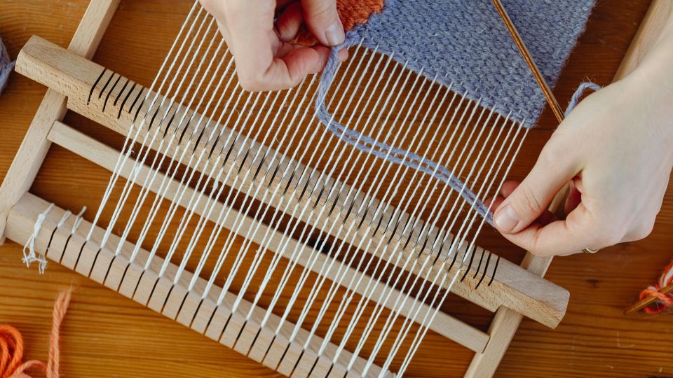 Weaver working on a loom.