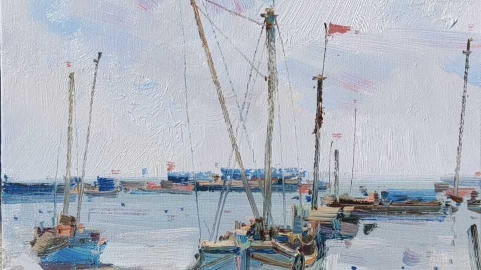 Impressionistic oil painting of several small sailboats docked on calm water under a cloudy sky. The boats have tall masts with red flags fluttering at the top, and their reflections ripple softly on the water’s surface. The color palette features cool blues, soft grays, and hints of warm brown and pink, conveying a tranquil seaside atmosphere.