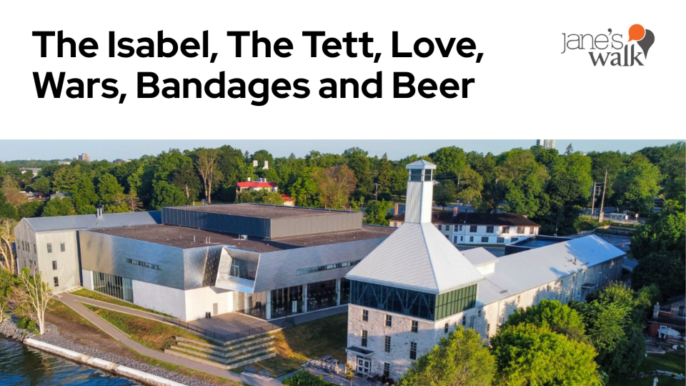 Aerial view of a modern building complex with a mix of stone and metal structures, surrounded by greenery. The text above reads "The Isabel, The Tett, Love, Wars, Bandages and Beer" with "Jane's Walk" logo in the top right corner.